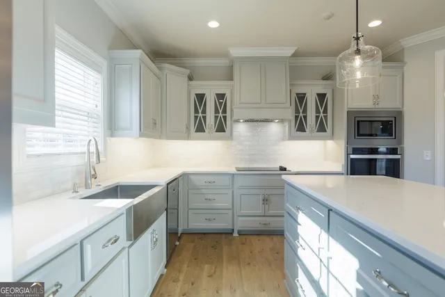 a kitchen with a sink and cabinets
