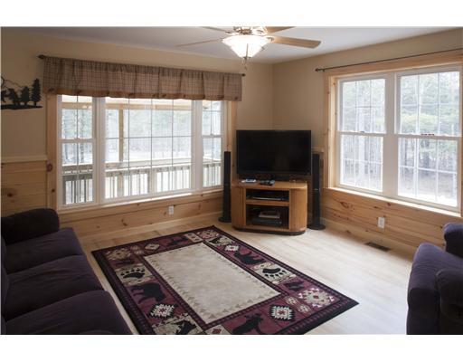 8 Beaver Brook Road Dover-Foxcroft, ME 04426 - Photo 12 of 25 Living Room. Ceiling fans keep the...