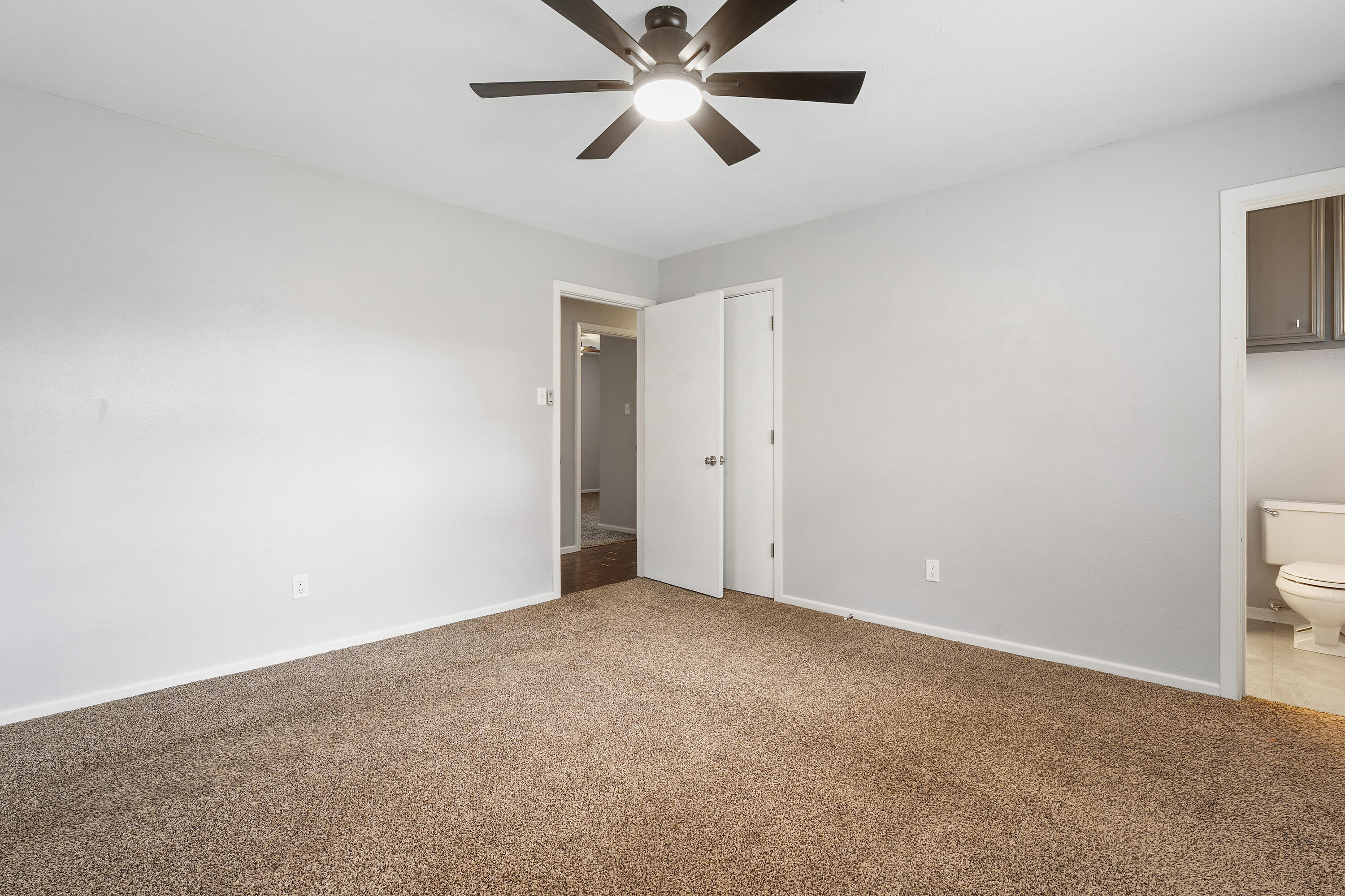 3823 62nd Drive Lubbock, TX 79413 - Photo 14 of 24 a view of an empty room and chandelier fan