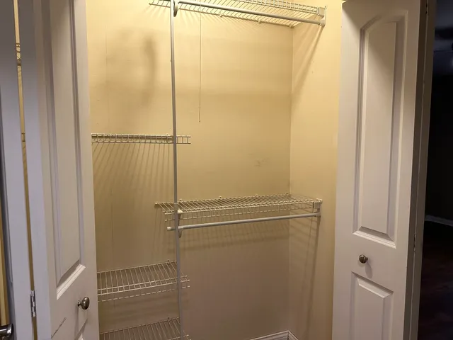 a bathroom with a glass shower door