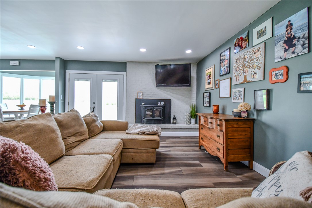 6169 Dayton Farmersville Road Dayton, OH 45417 - Photo 23 of 64 This living area features a warm fireplace and durable flooring, perfect for comfortable gatherings.