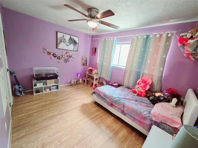 a bedroom with furniture and a chandelier