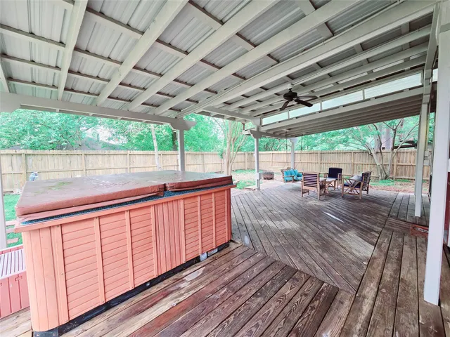 a view of a backyard with sitting area