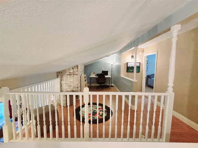 a view of a porch with wooden floor