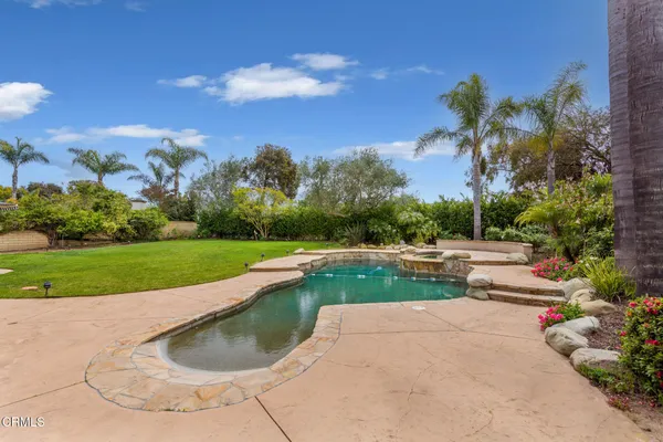 a utility room with sink dryer and washer