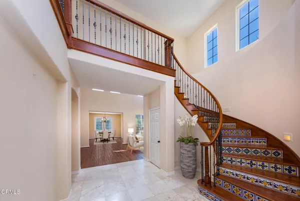 a kitchen with granite countertop a stove and a refrigerator