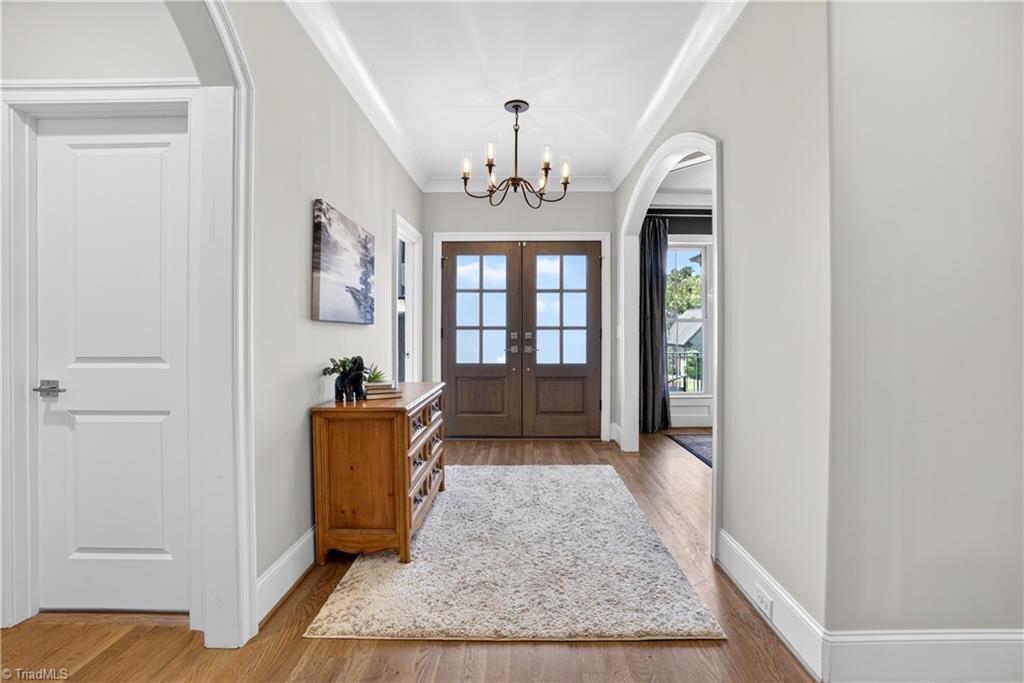6634 Linville Ridge Drive Oak Ridge, NC 27310 - Photo 7 of 50 Bright foyer with double front doors and an arch entry into the dining room