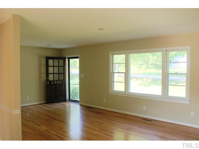 2301 Doran Place Raleigh, NC 27604 - Photo 5 of 11 a view of an empty room with wooden floor and a window