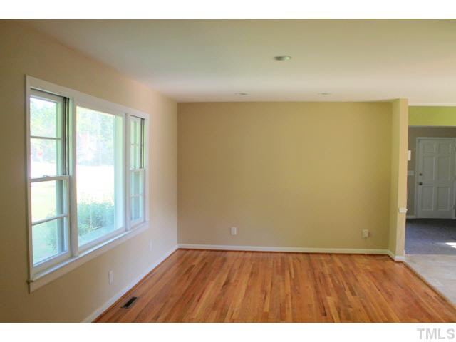 2301 Doran Place Raleigh, NC 27604 - Photo 6 of 11 a view of an empty room and wooden floor
