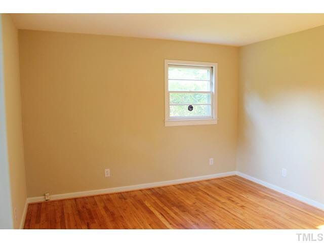 2301 Doran Place Raleigh, NC 27604 - Photo 10 of 11 an empty room with wooden floor and a window