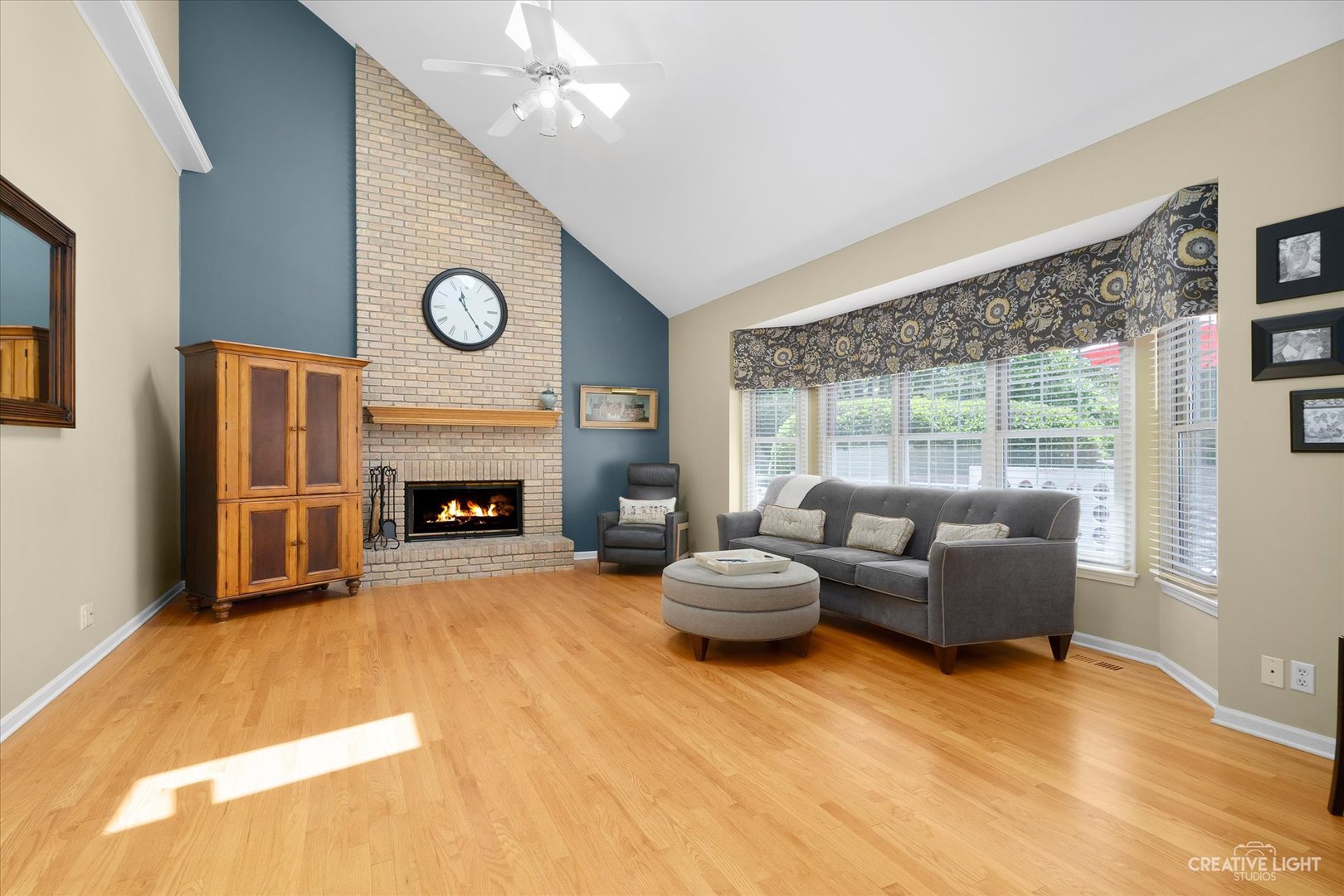 2636 Sweetbroom Road Naperville, IL 60564 - Photo 9 of 35 a living room with furniture and a fireplace