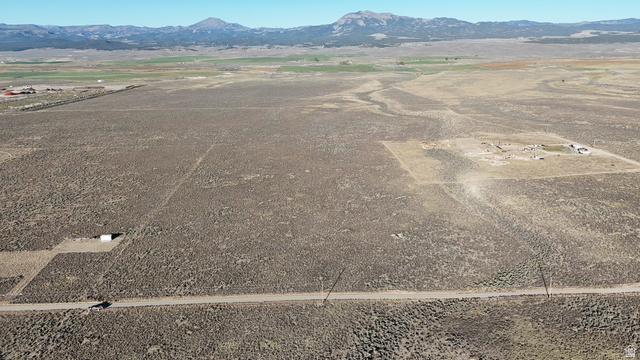 4855 Peakview Road Panguitch, UT 84759 - Photo 17 of 33 Aerial view of sparsely populated area featuring a mountain backdrop