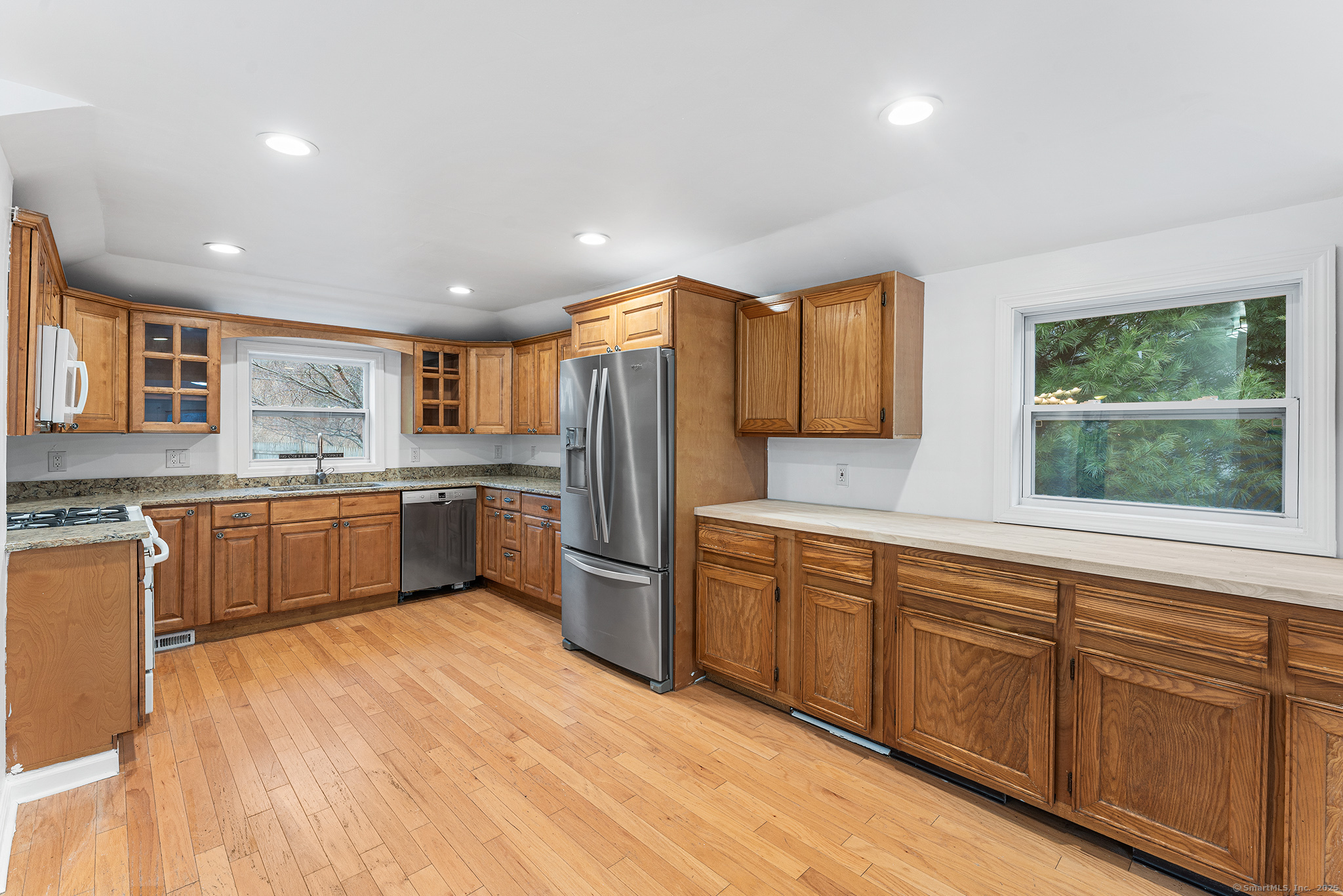 20 Georgetown Road Weston, CT 06883 - Photo 1 of 30 a large kitchen with stainless steel appliances granite countertop a stove sink and cabinets