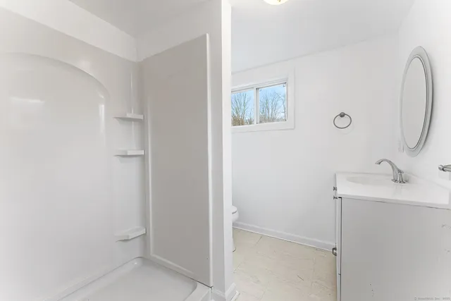 a bathroom with a sink and mirror