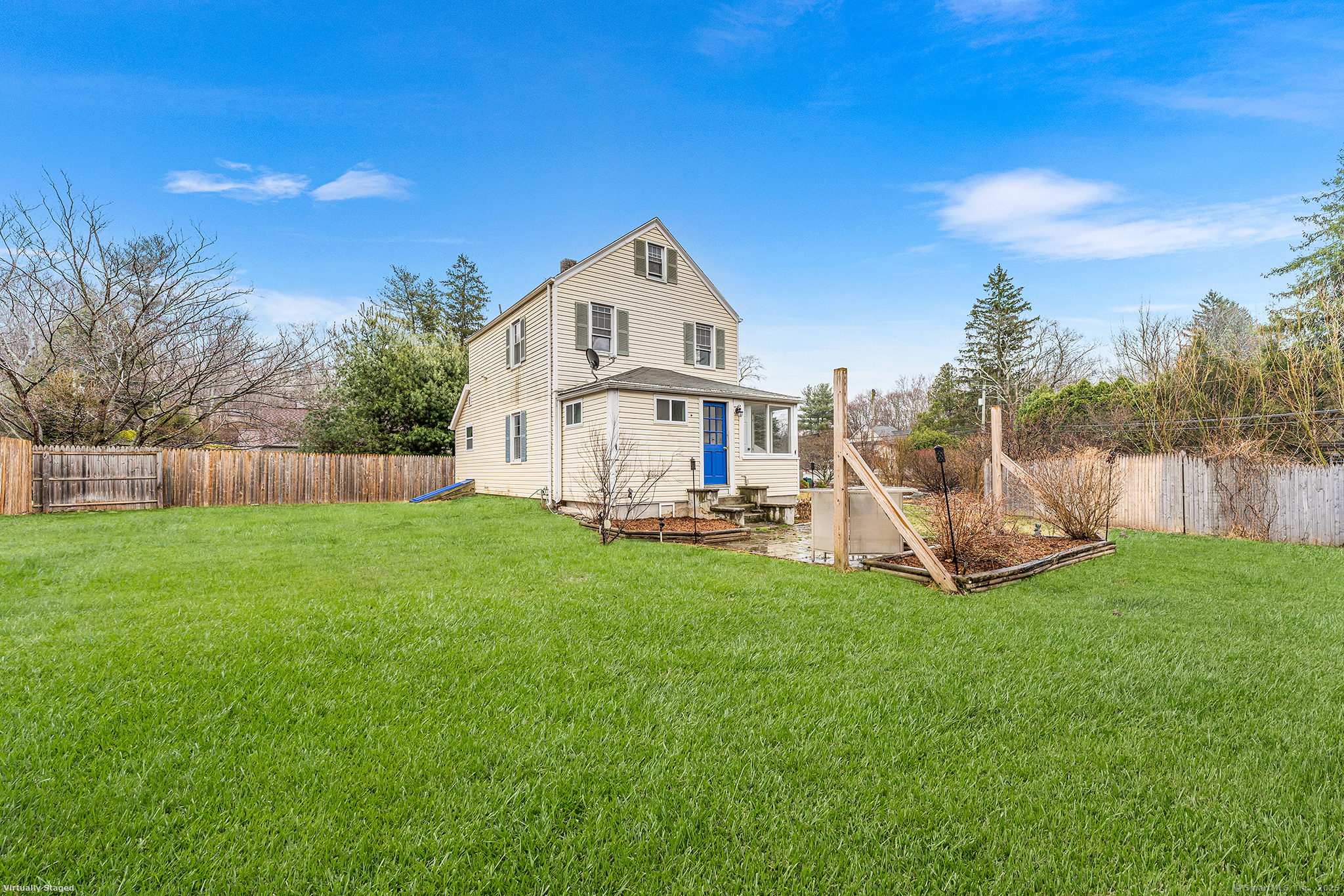 20 Georgetown Road Weston, CT 06883 - Photo 28 of 30 a view of a house with a yard and deck