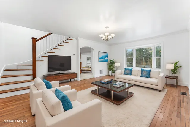 a living room with furniture fireplace and flat screen tv