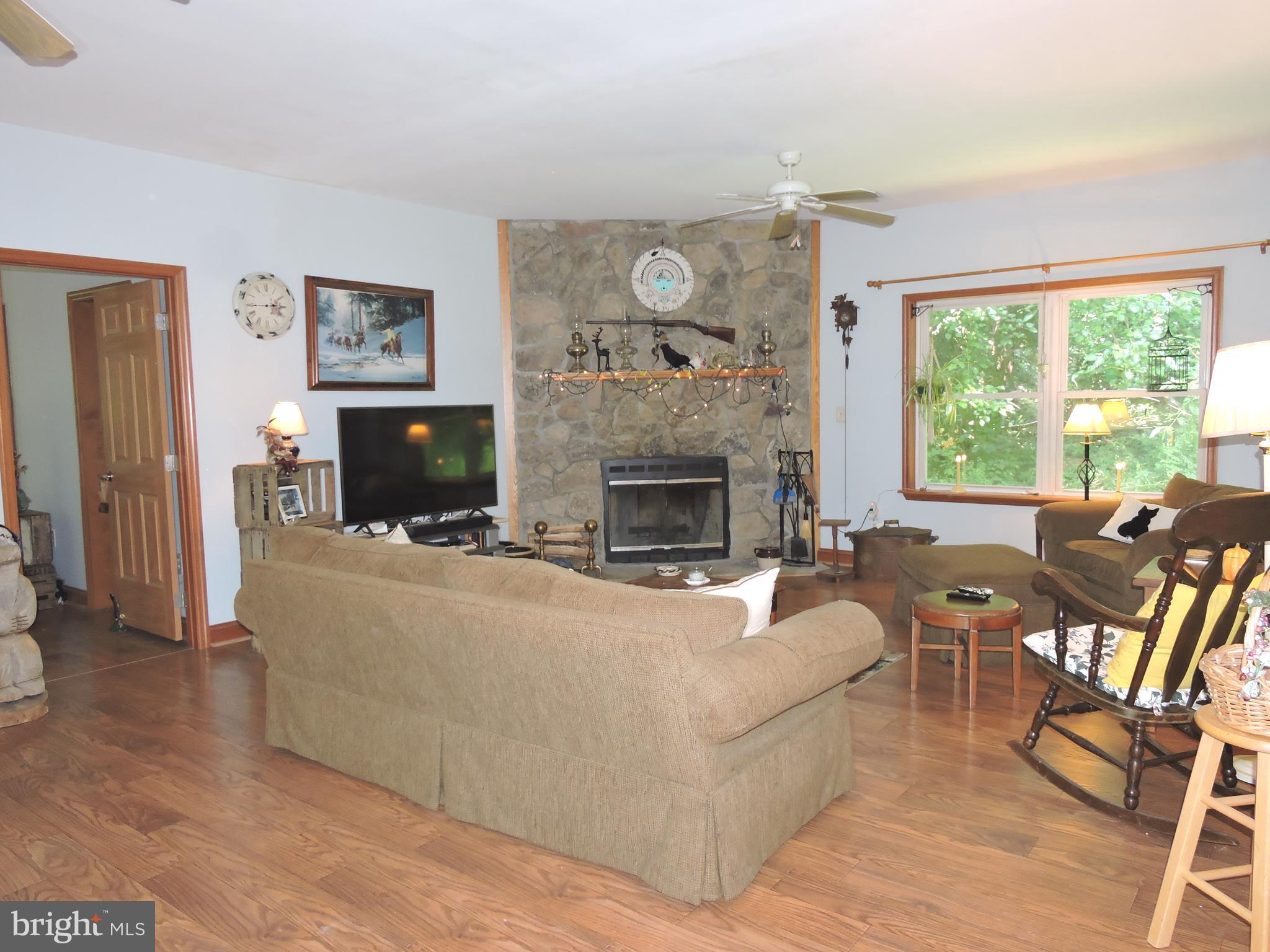 Open Living Room with Wood burning fireplace