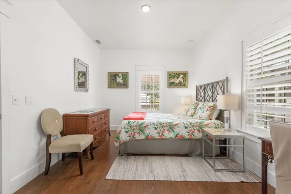 a bathroom with a sink a mirror a vanity and a shower