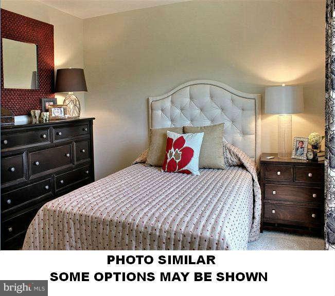 42237 Shorecrest Terrace Aldie, VA 20105 - Photo 7 of 16 a bedroom with a bed and a closet