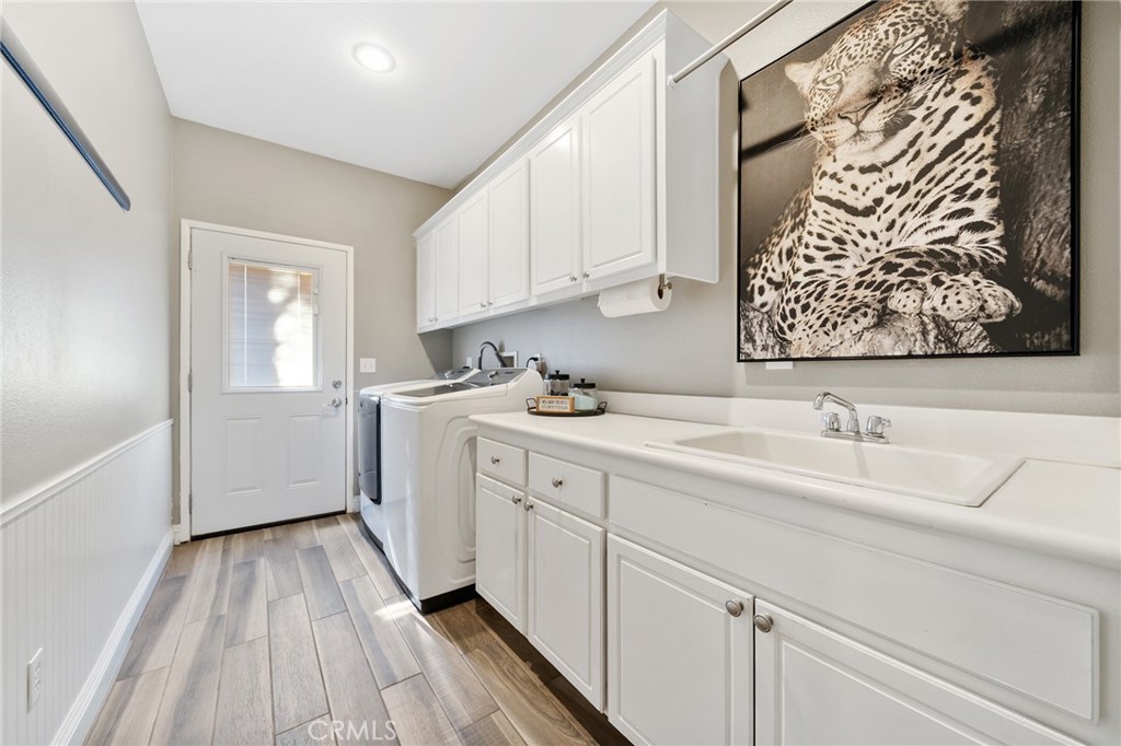 36232 Village Road Yucaipa, CA 92399 - Photo 19 of 34 a kitchen with a sink and cabinets