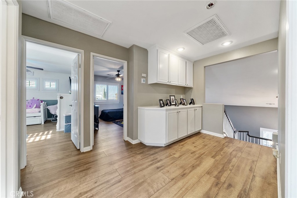 36232 Village Road Yucaipa, CA 92399 - Photo 23 of 34 a kitchen with a refrigerator and a table