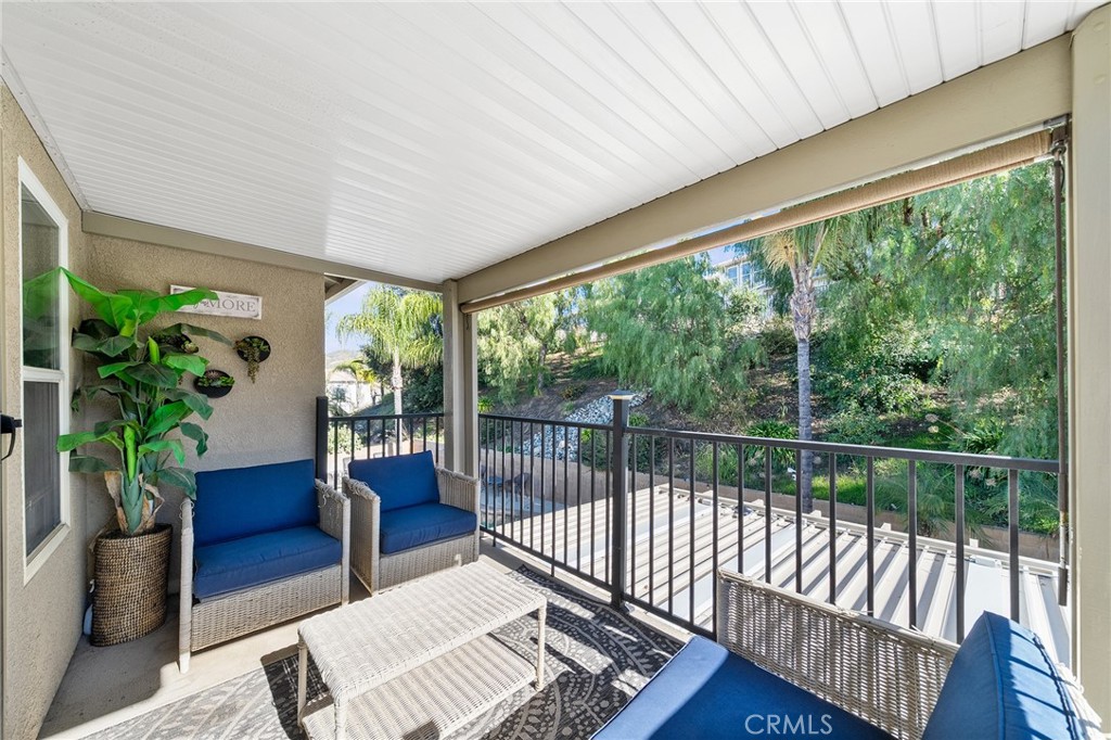 36232 Village Road Yucaipa, CA 92399 - Photo 26 of 34 a living room with furniture and a potted plant