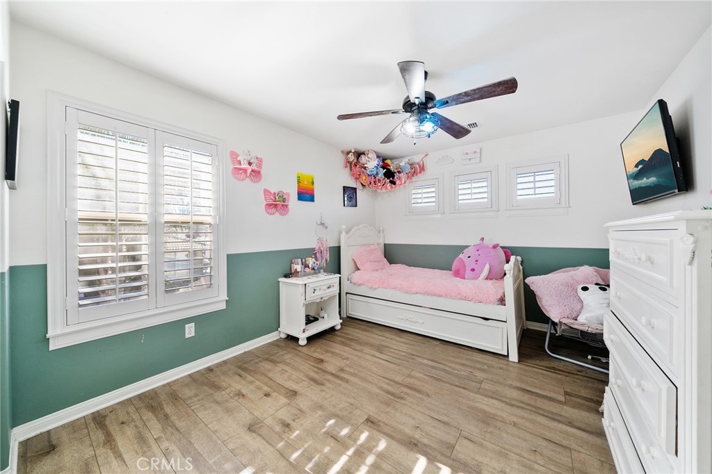 36232 Village Road Yucaipa, CA 92399 - Photo 30 of 34 a bedroom with a bed and a flat screen tv
