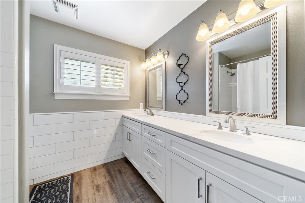 36232 Village Road Yucaipa, CA 92399 - Photo 31 of 34 a bathroom with a double vanity sink mirror and