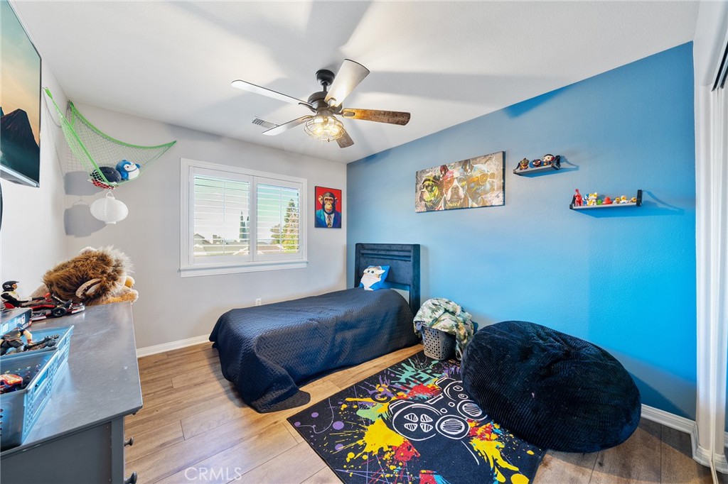 36232 Village Road Yucaipa, CA 92399 - Photo 32 of 34 a bedroom with a bed and a window