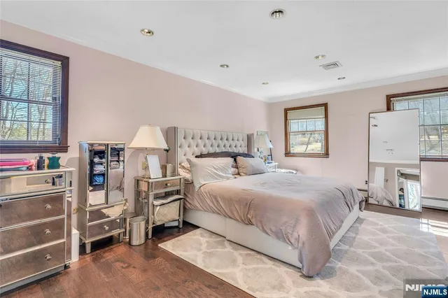 a bedroom with a bed and a cabinets