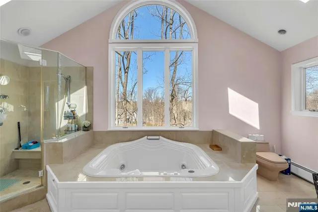 a bathroom with a bathtub and window
