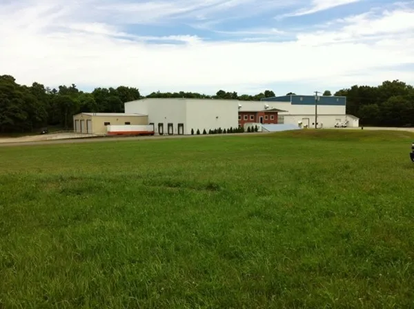 a view of a big yard with a lake view
