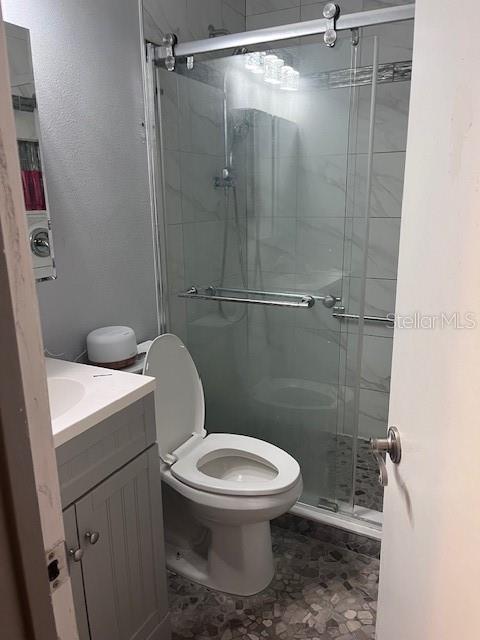 888 Longdale Avenue Longwood, FL 32750 - Photo 12 of 17 a bathroom with a toilet and a shower