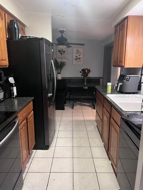 888 Longdale Avenue Longwood, FL 32750 - Photo 6 of 17 a kitchen with a refrigerator a stove a sink and a counter top space
