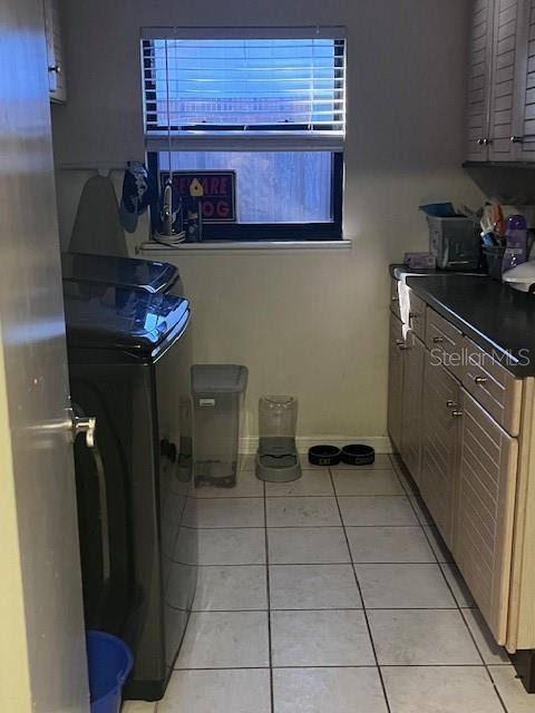 888 Longdale Avenue Longwood, FL 32750 - Photo 7 of 17 a kitchen with a sink a refrigerator and cabinets
