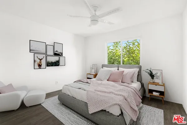 a bedroom with a bed and a couch