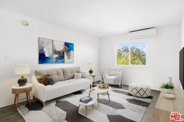 a living room with furniture and a rug