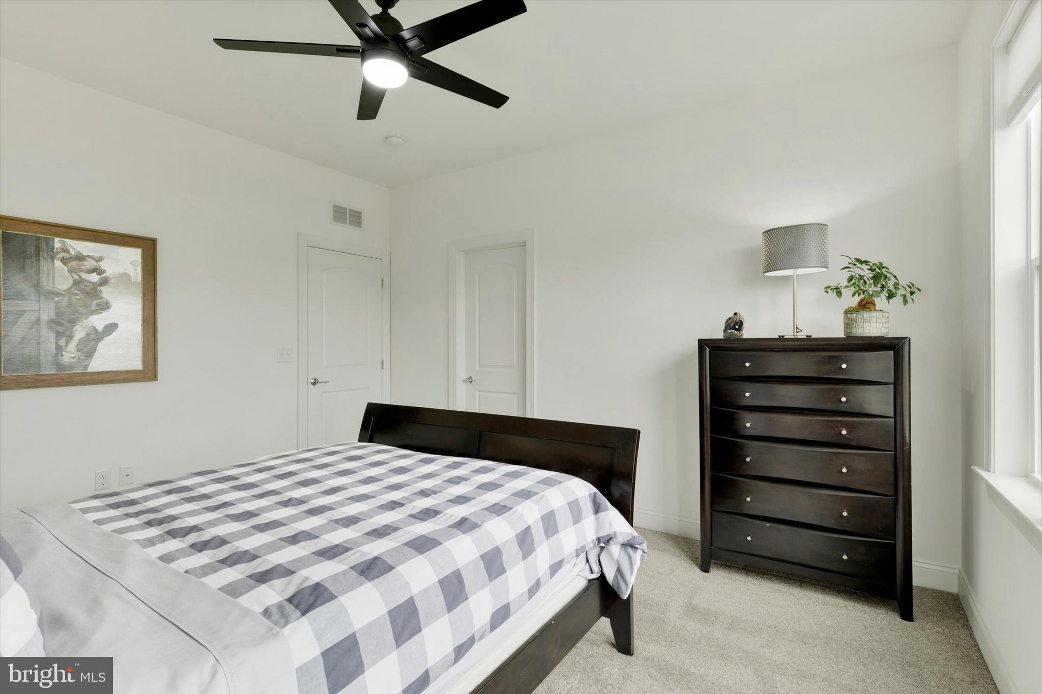 1033 Lititz Bend Drive Lititz, PA 17543 - Photo 35 of 58 a bedroom with a bed and a dresser