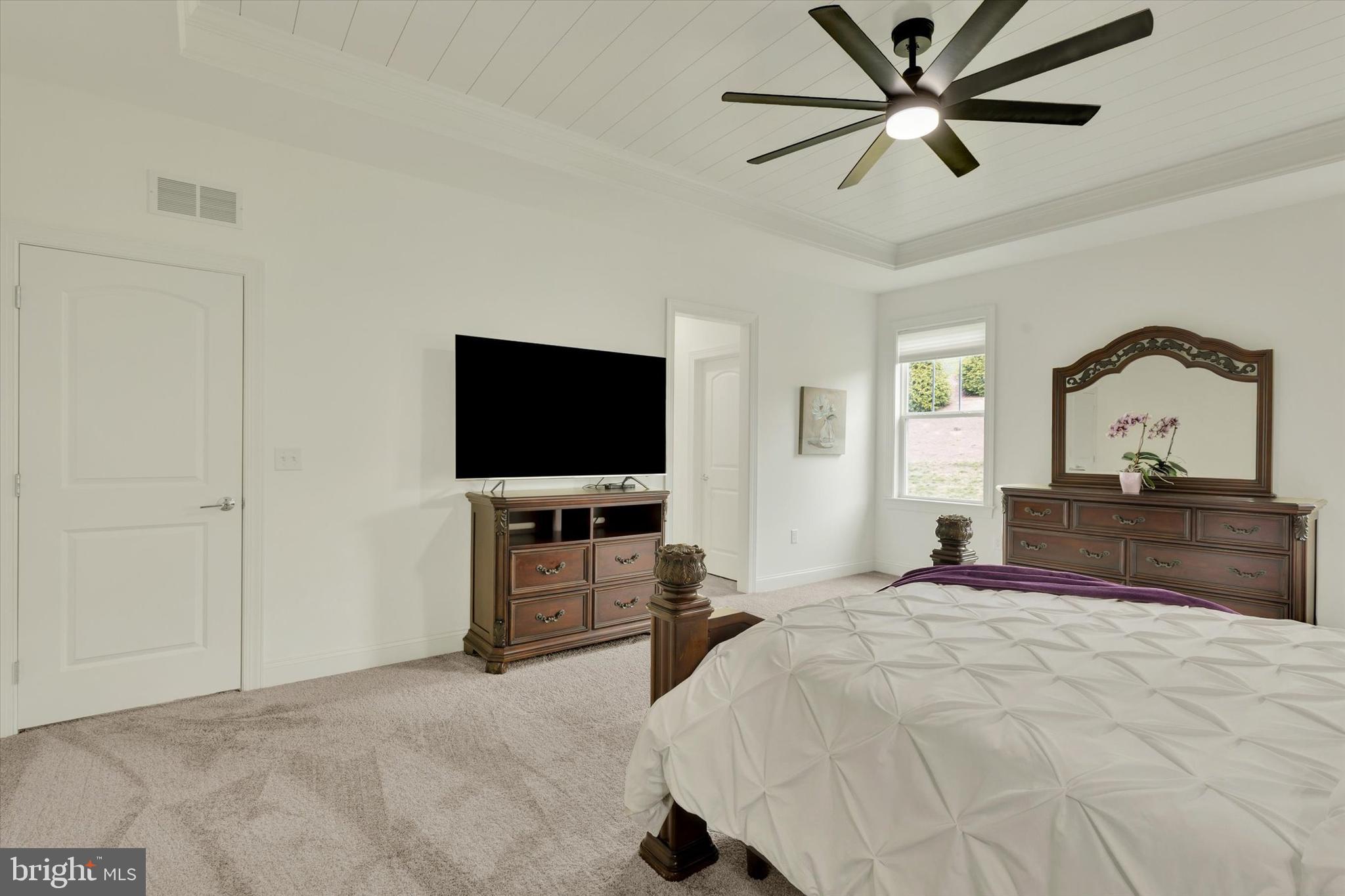 1033 Lititz Bend Drive Lititz, PA 17543 - Photo 43 of 58 a bedroom with a bed and a flat screen tv
