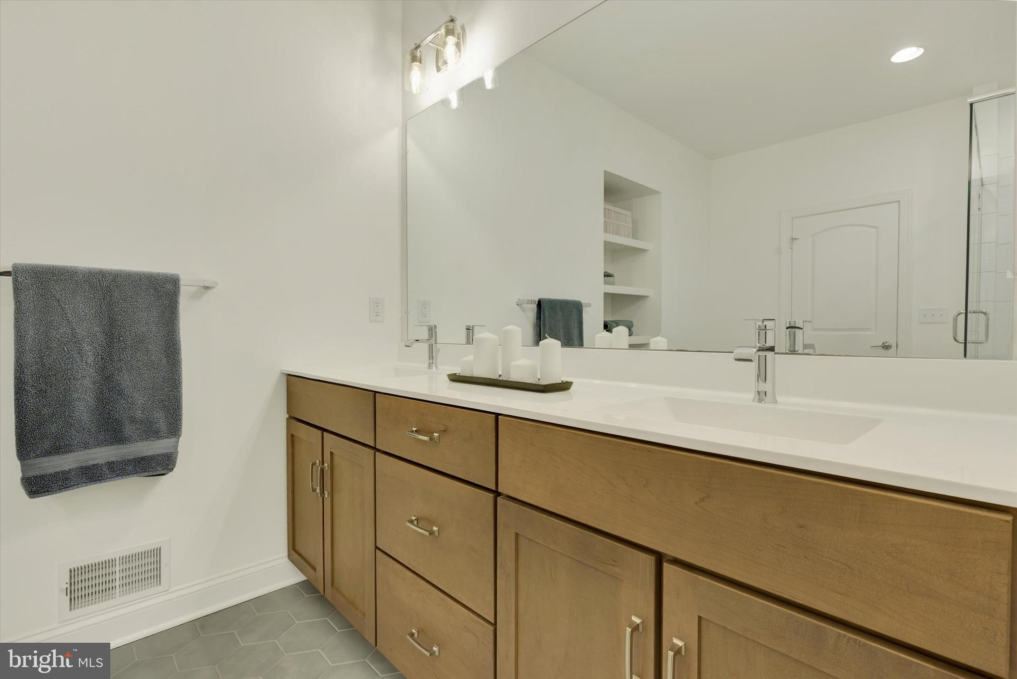 1033 Lititz Bend Drive Lititz, PA 17543 - Photo 48 of 58 a bathroom with a sink double vanity and a mirror