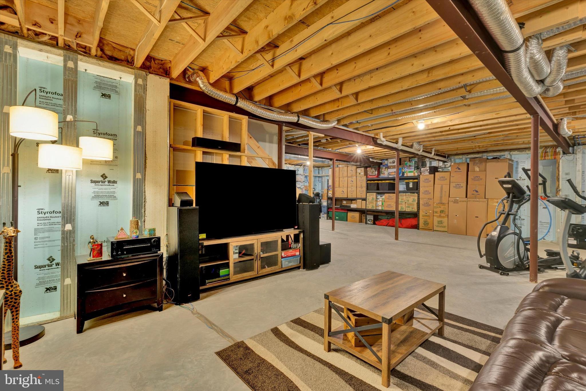 1033 Lititz Bend Drive Lititz, PA 17543 - Photo 50 of 58 a room with gym equipment and a flat screen tv