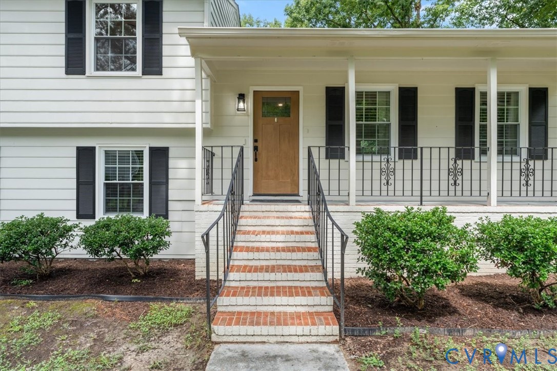 7010 Slate Road Chesterfield, VA 23832 - Photo 6 of 45 Entryway featuring a wood-finish door, covered por