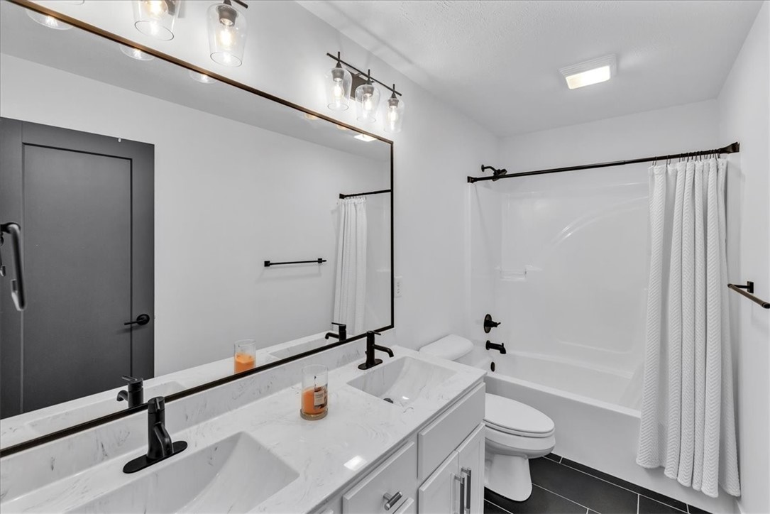 908 Declaration Drive Savoy, IL 61874 - Photo 30 of 41 a bathroom with a sink a toilet and shower