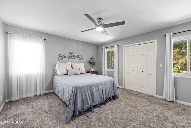 a bedroom with a bed and window