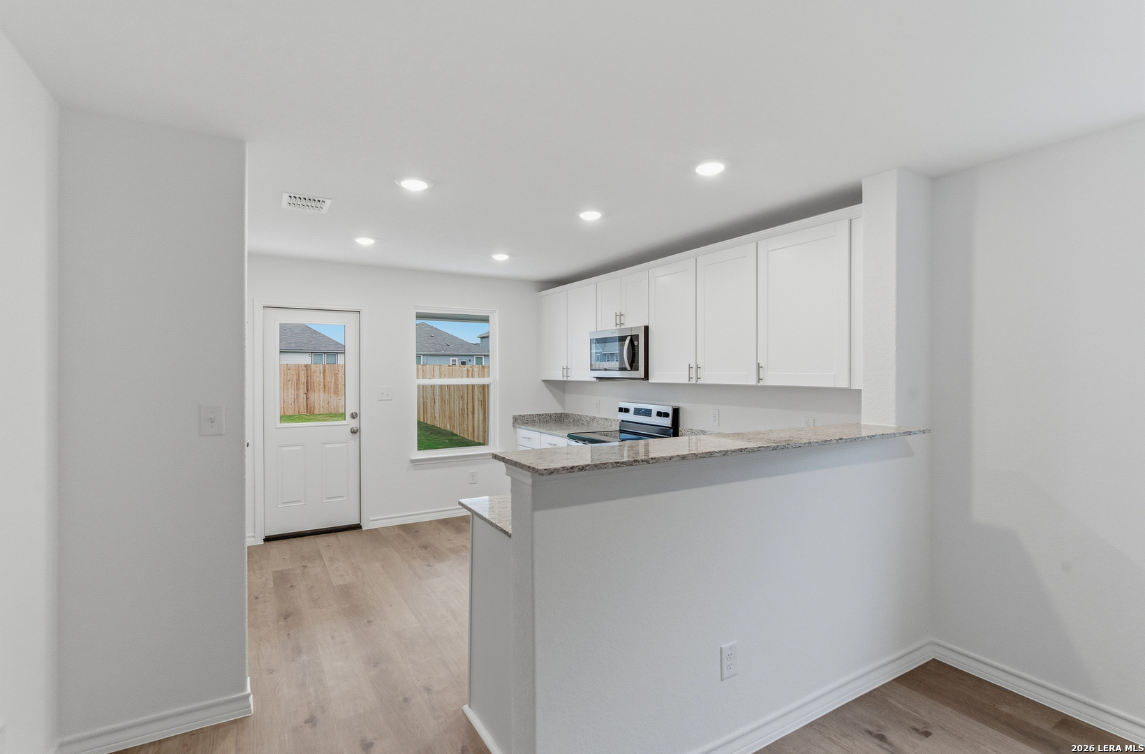 4142 Bermuda Lane Seguin, TX 78155 - Photo 11 of 30 a kitchen with stainless steel appliances granite countertop a sink and cabinets
