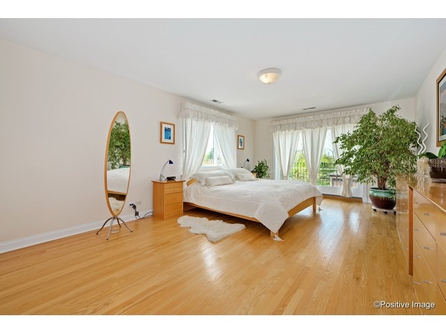 1019 North Delphia Avenue Park Ridge, IL 60068 - Photo 14 of 25 a bedroom with a bed and a large window