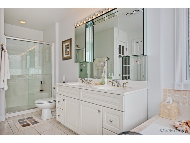 1019 North Delphia Avenue Park Ridge, IL 60068 - Photo 17 of 25 a bathroom with a sink a toilet a mirror and shower