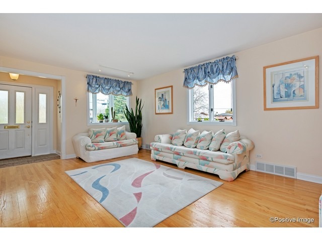 1019 North Delphia Avenue Park Ridge, IL 60068 - Photo 3 of 25 a living room with furniture and a wooden floor