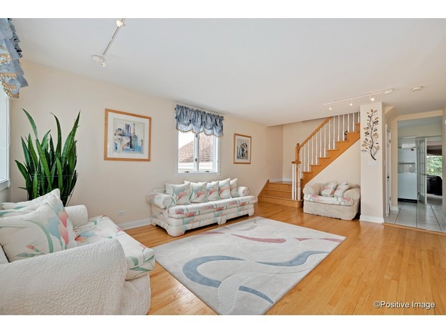 1019 North Delphia Avenue Park Ridge, IL 60068 - Photo 4 of 25 a living room with furniture and a potted plant