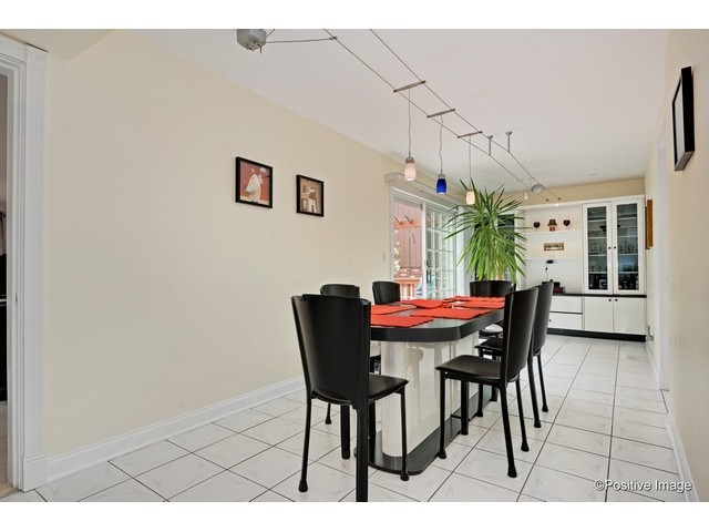 1019 North Delphia Avenue Park Ridge, IL 60068 - Photo 9 of 25 a dining room with furniture and window